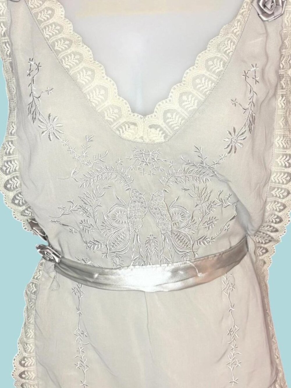 Gray lace top with silver ribbon and flower details